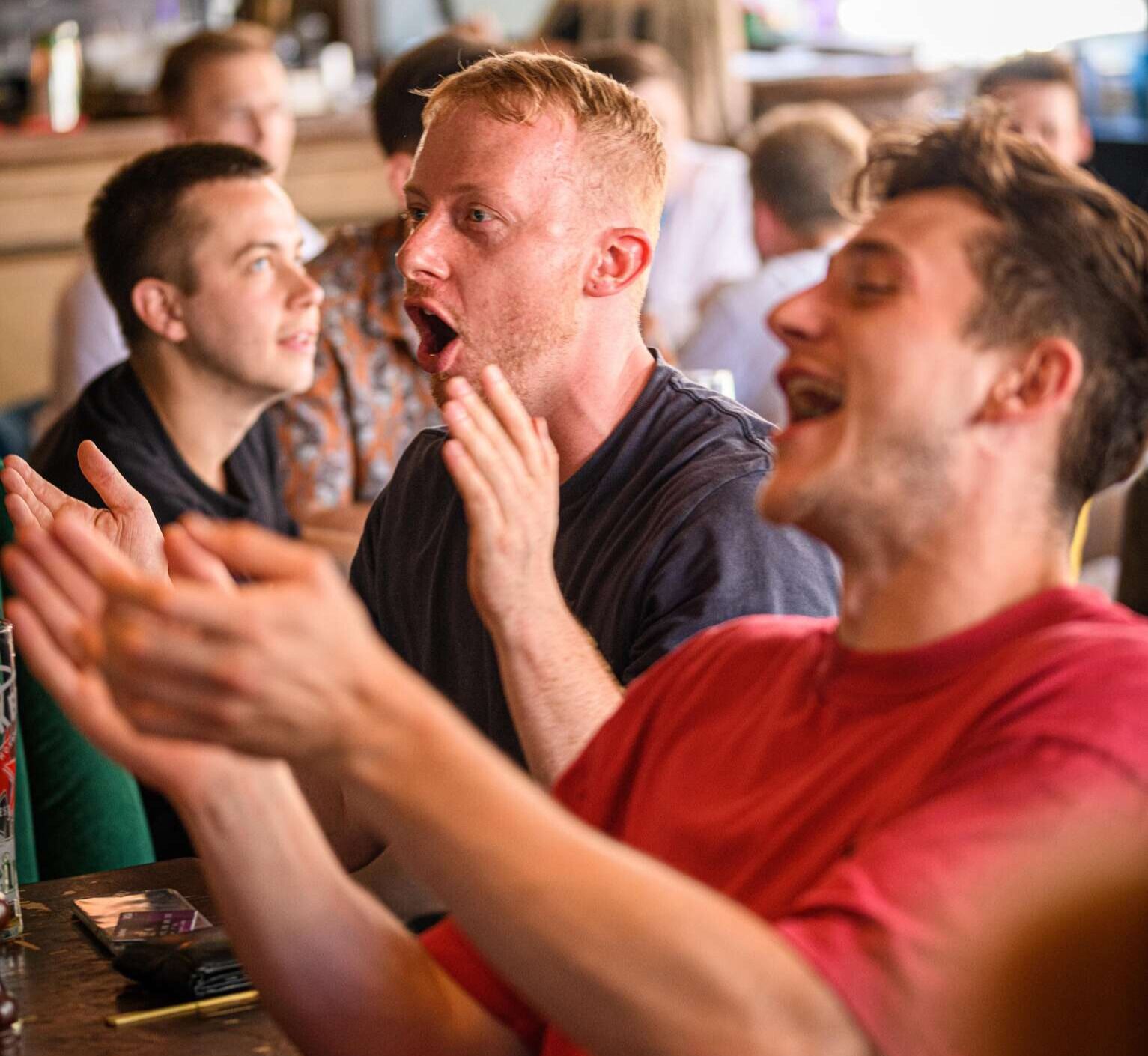 Man enjoying sports game with friends.