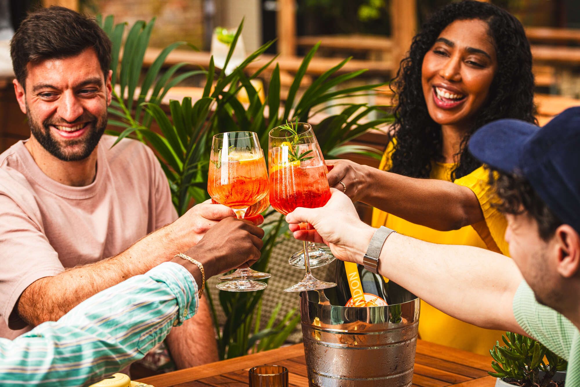 People sitting outside enjoying a glass of spritz